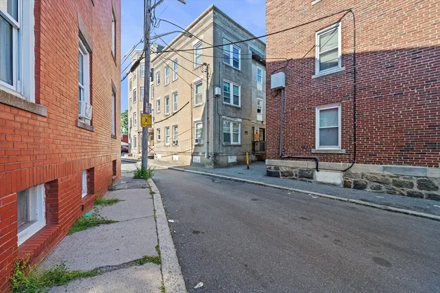 a view of a brick building with many windows