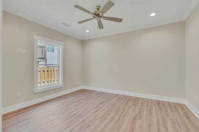 a bathroom with a granite countertop sink mirror and a bathtub