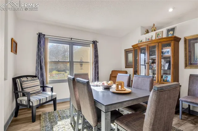 a view of a dining room with furniture window and outside view