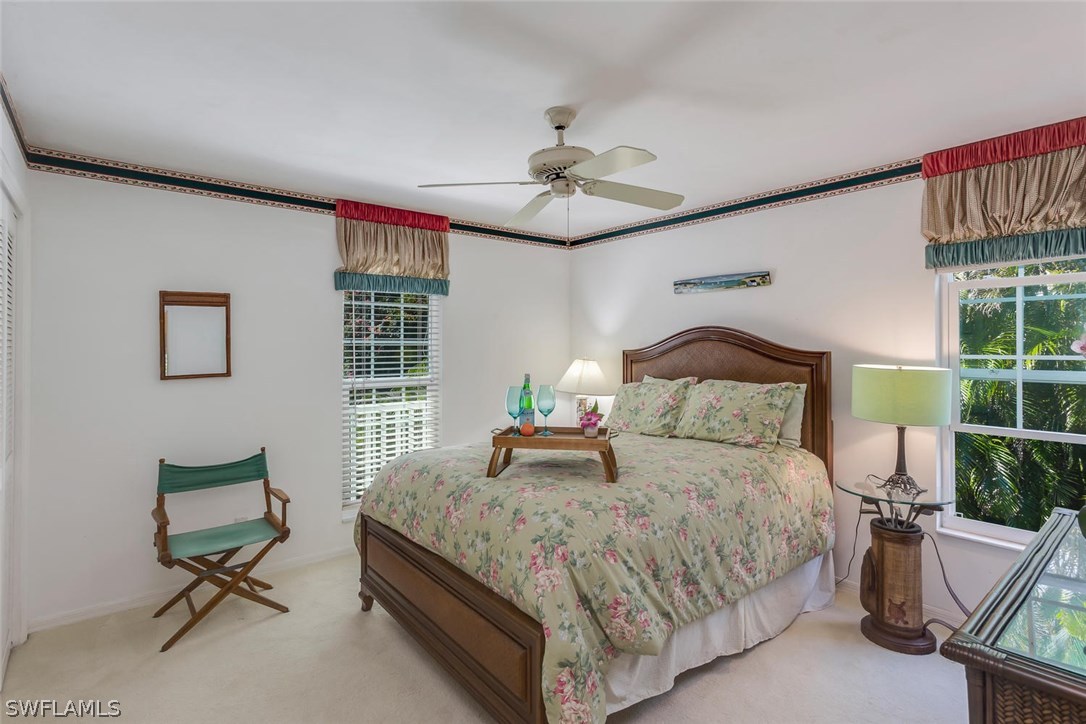 1341 Sand Castle Road Sanibel, FL 33957 - Photo 11 of 18 a bedroom with a bed and a window