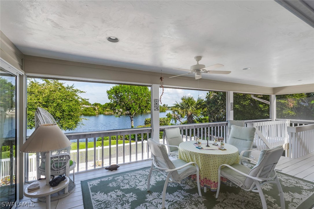 1341 Sand Castle Road Sanibel, FL 33957 - Photo 15 of 18 a view of a patio with a table chairs and a porch