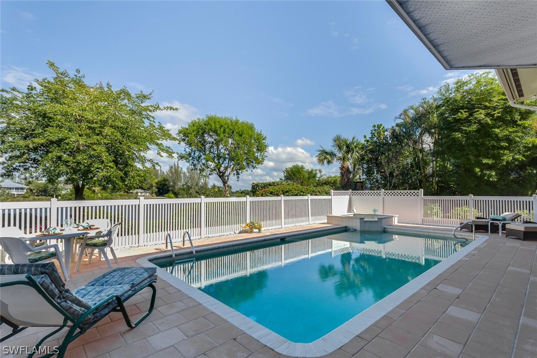 1341 Sand Castle Road Sanibel, FL 33957 - Photo 17 of 18 a view of a chairs and tables in the terrace