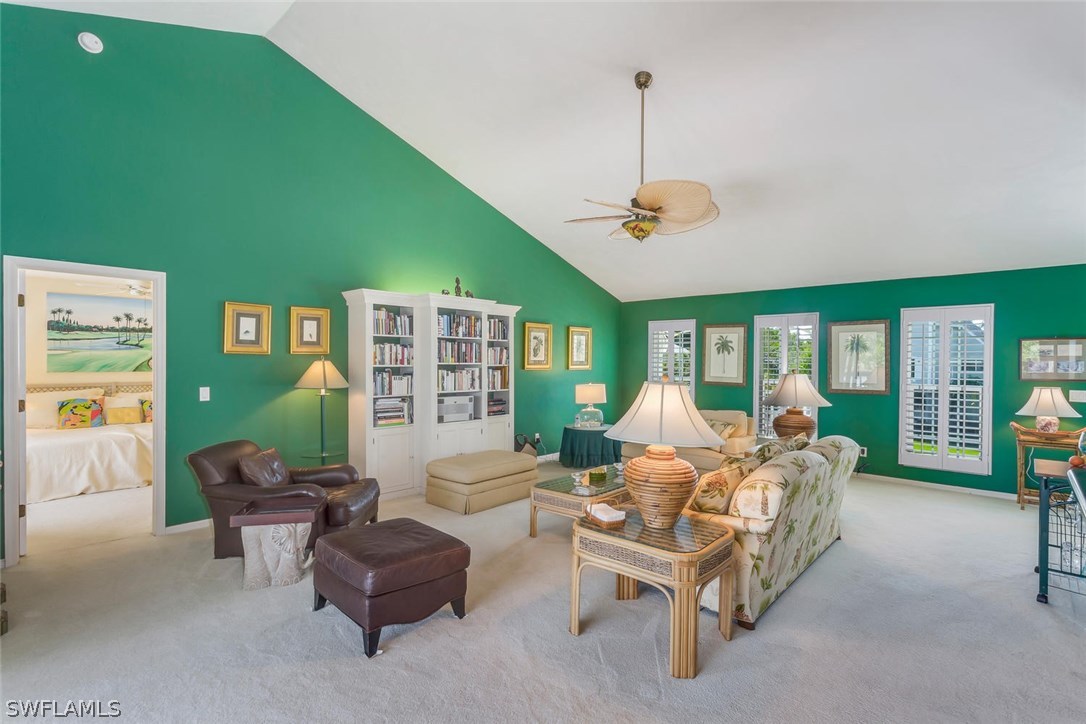 1341 Sand Castle Road Sanibel, FL 33957 - Photo 7 of 18 a living room with furniture and a chandelier