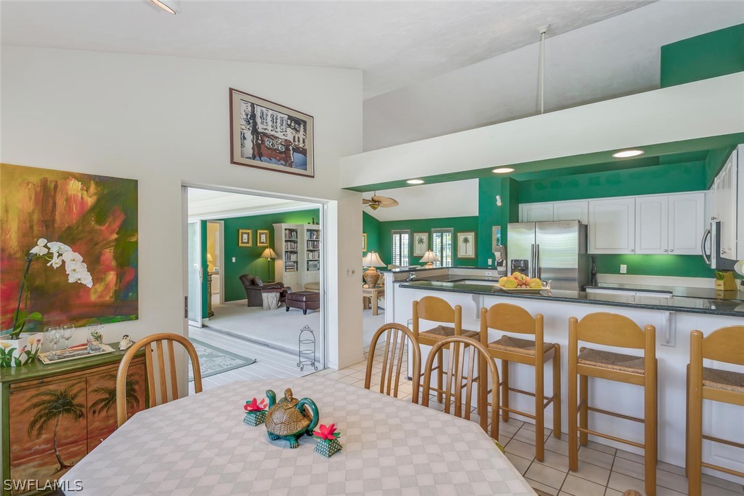 1341 Sand Castle Road Sanibel, FL 33957 - Photo 9 of 18 a dining area with furniture kitchen view and a large window