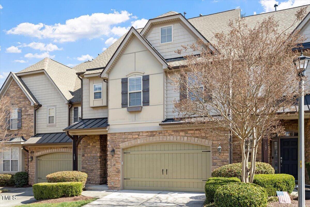 a front view of a house with a garage