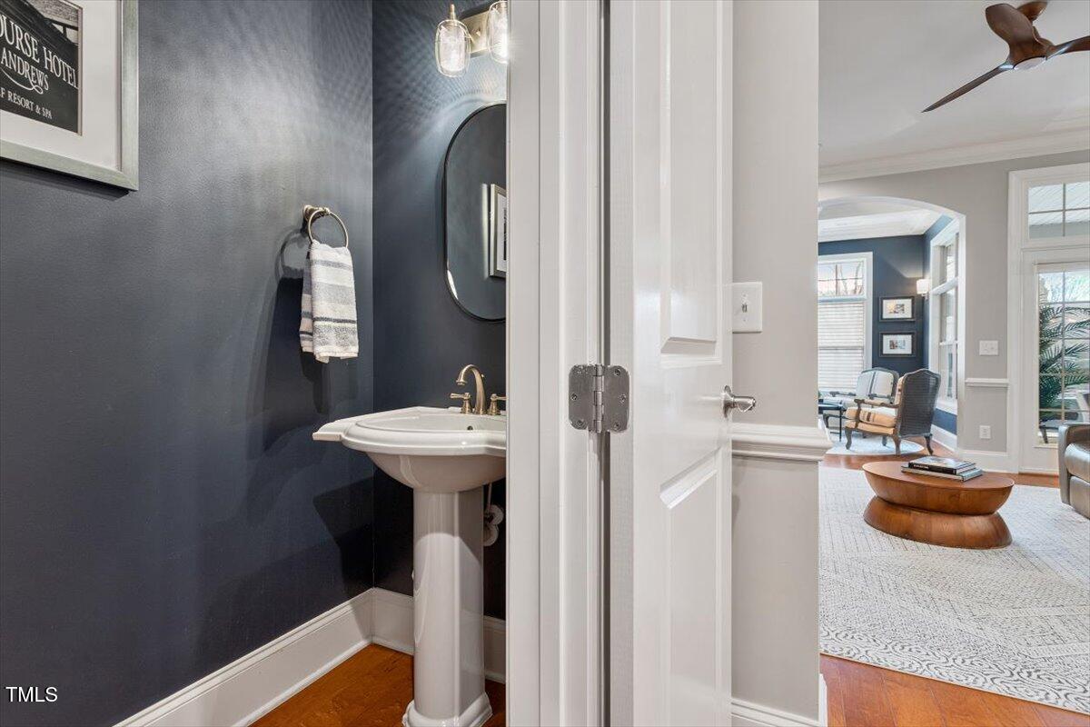 105 Sunstone Drive Cary, NC 27519 - Photo 14 of 25 a bathroom with a sink a mirror and vanity