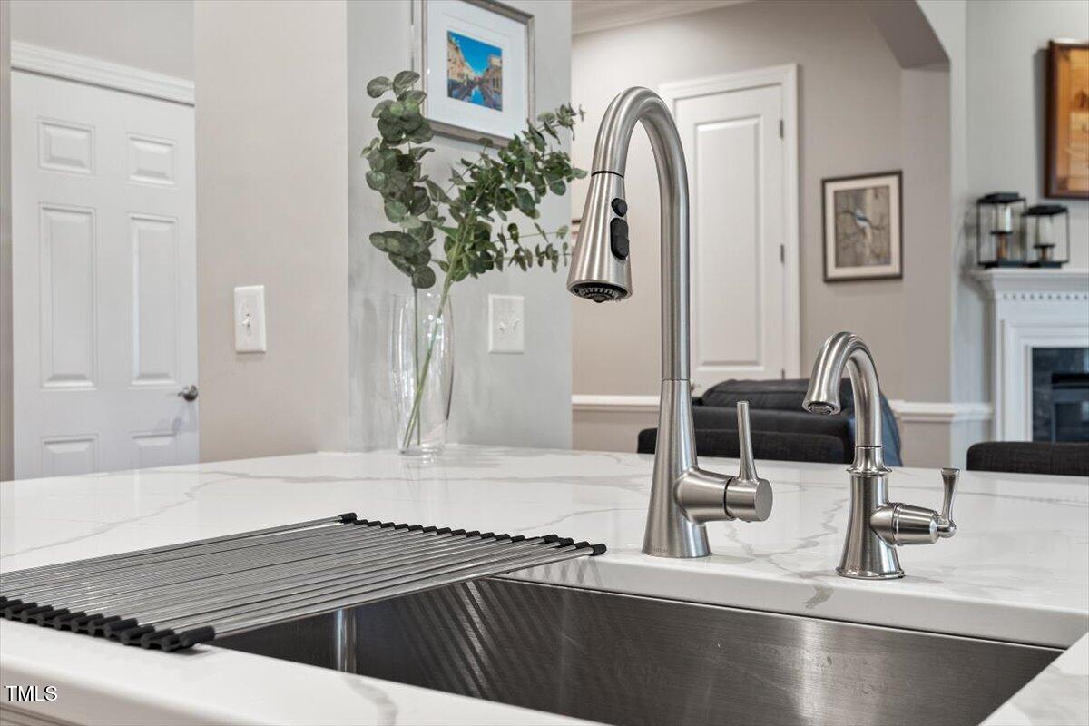 105 Sunstone Drive Cary, NC 27519 - Photo 7 of 25 a kitchen with a sink and a stove top oven