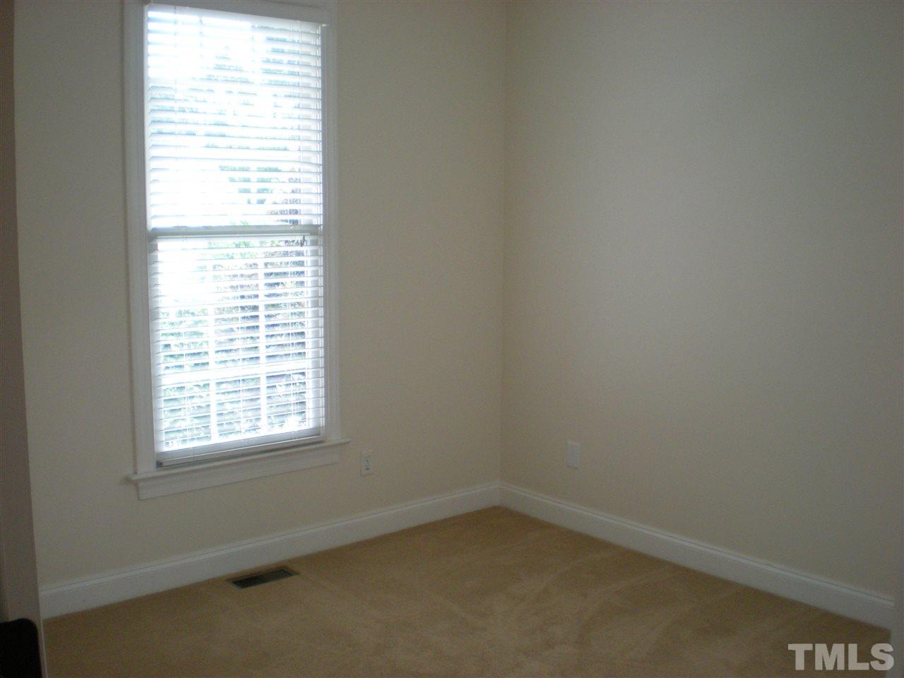 6301 Pleasant Creek Court Raleigh, NC 27613 - Photo 11 of 21 an empty room with a window