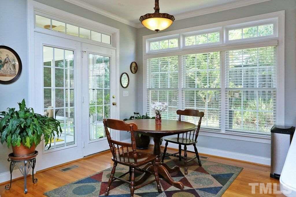 6301 Pleasant Creek Court Raleigh, NC 27613 - Photo 6 of 21 a view of a dining room with furniture window and wooden floor