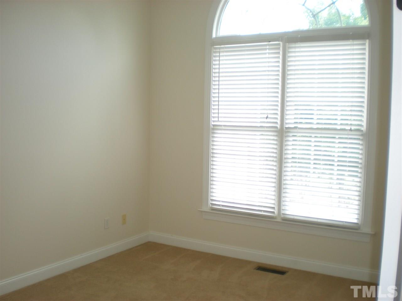6301 Pleasant Creek Court Raleigh, NC 27613 - Photo 10 of 21 an empty room with a window
