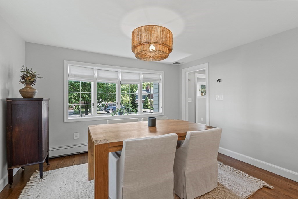 49 Ripley Road Medford, MA 02155 - Photo 12 of 39 a dining room with furniture and a window