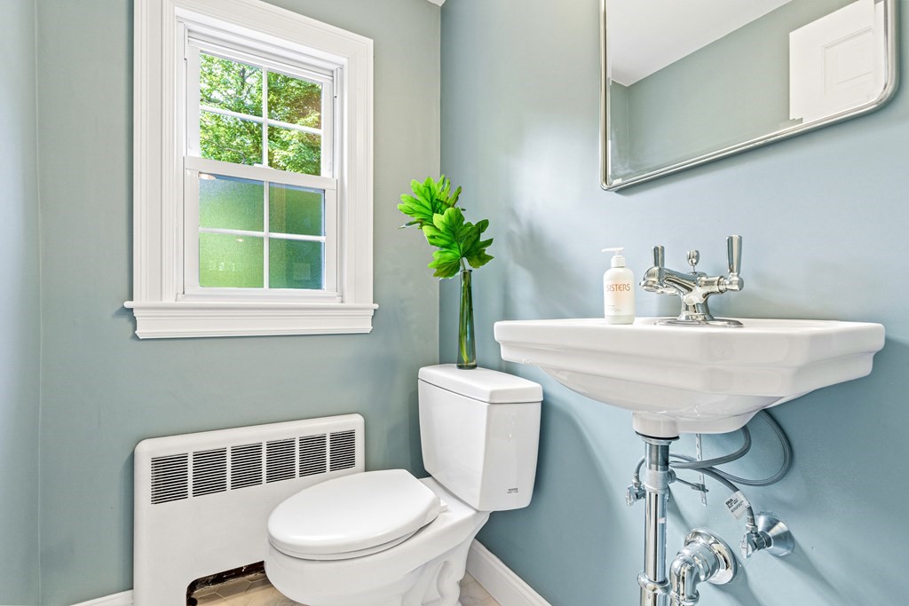 49 Ripley Road Medford, MA 02155 - Photo 15 of 39 a bathroom with a toilet a sink and a mirror