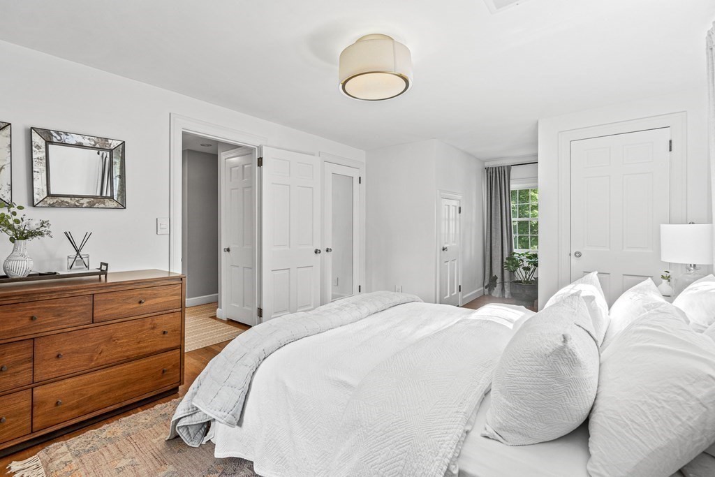 49 Ripley Road Medford, MA 02155 - Photo 18 of 39 a bedroom with a bed and a dresser