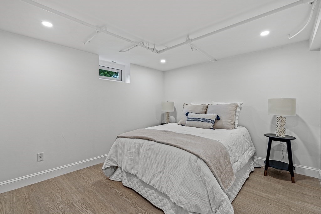 49 Ripley Road Medford, MA 02155 - Photo 25 of 39 a bedroom with a bed and a night stand