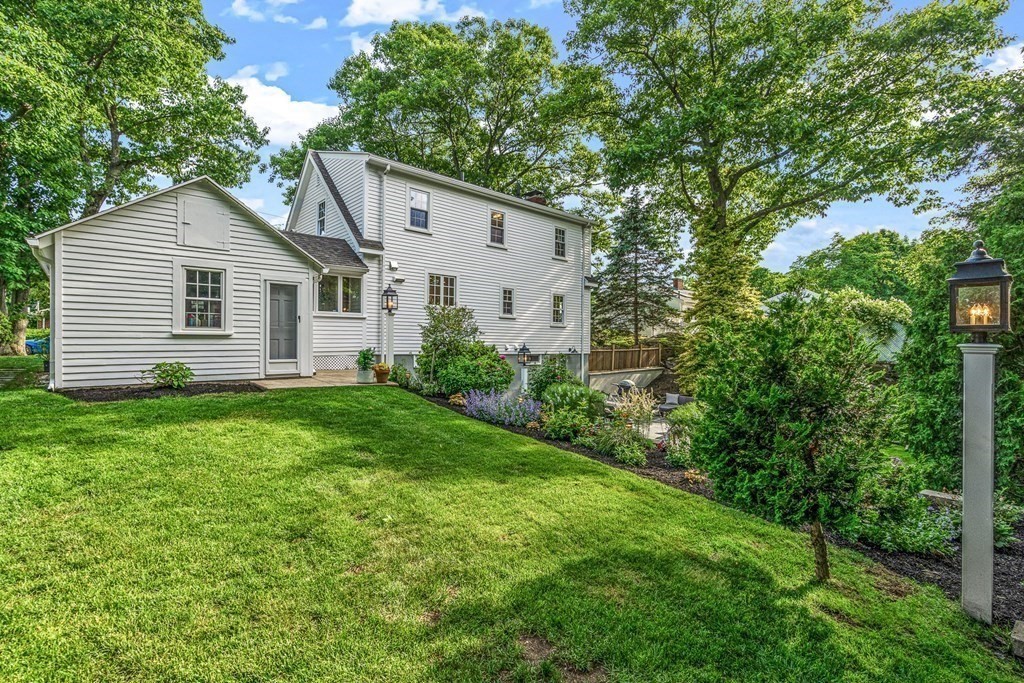 49 Ripley Road Medford, MA 02155 - Photo 32 of 39 a view of a backyard with plants and large tree