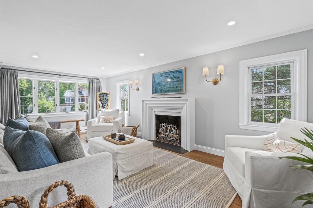 49 Ripley Road Medford, MA 02155 - Photo 6 of 39 a living room with furniture a large window and a fireplace