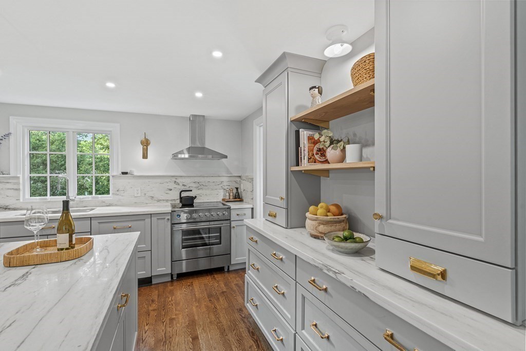 49 Ripley Road Medford, MA 02155 - Photo 9 of 39 a kitchen with a sink stove and cabinets