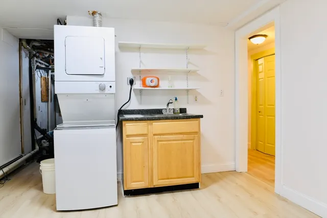 a kitchen with a refrigerator and a stove