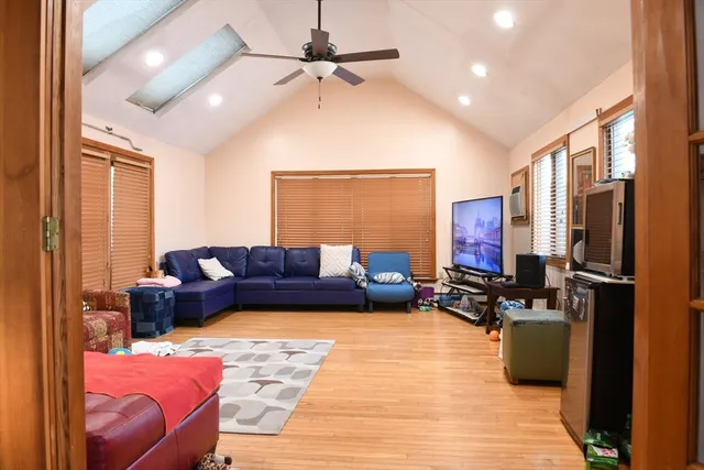 a living room with furniture rug and window