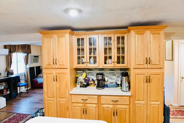 a view of washer and dryer with wooden floor