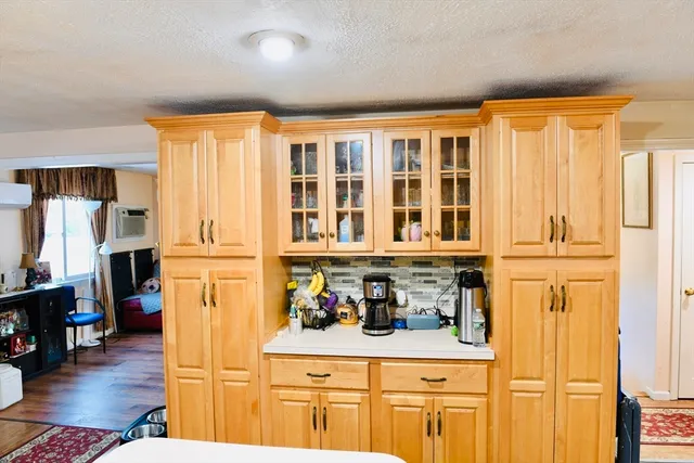 a view of washer and dryer with wooden floor