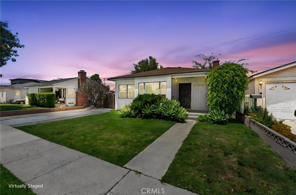 2725 East Tyler Street Carson, CA 90810 - Photo 1 of 30 a front view of a house with a yard