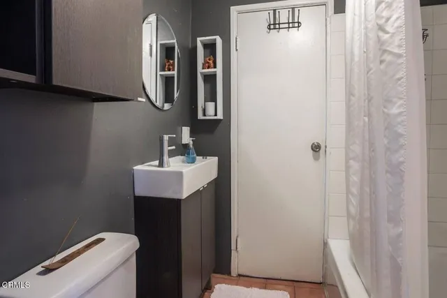 a view of a dining room with furniture large windows and wooden floor