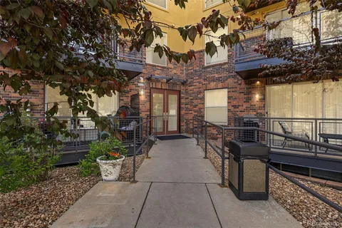 a view of a chairs and table in the patio