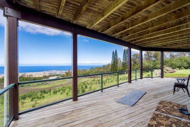 a view of room with window and front door