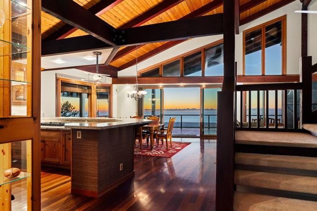 a view of a patio with table and chairs