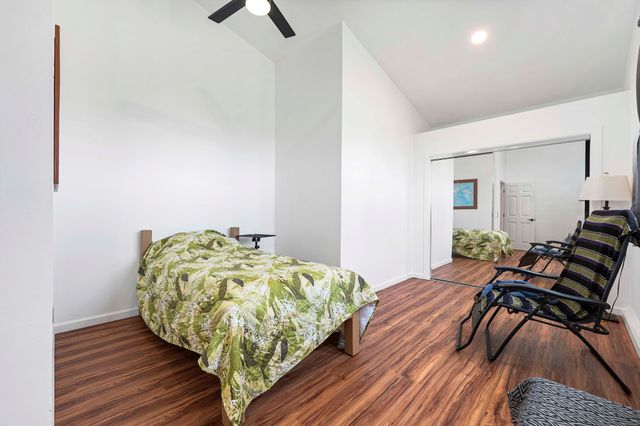 a view of a city with lush green forest