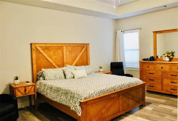 a bedroom with a bed and window