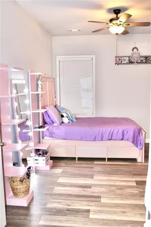 a bedroom with a bed and a table