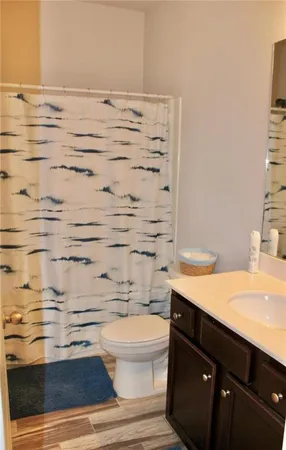 a bedroom with double bunk beds and ceiling fan