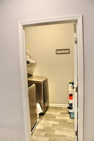 a bathroom with a sink vanity mirror and toilet