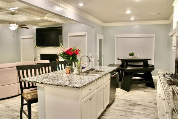a kitchen island with granite countertop dining room