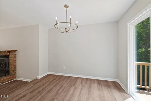 a kitchen with white cabinets sink and stainless steel appliances