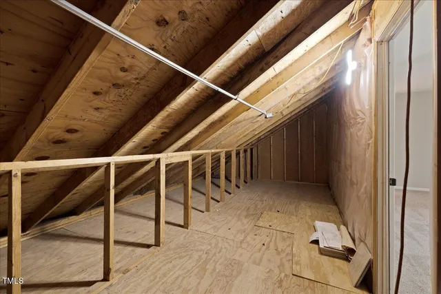 a bathroom with a sink and mirror with toilet