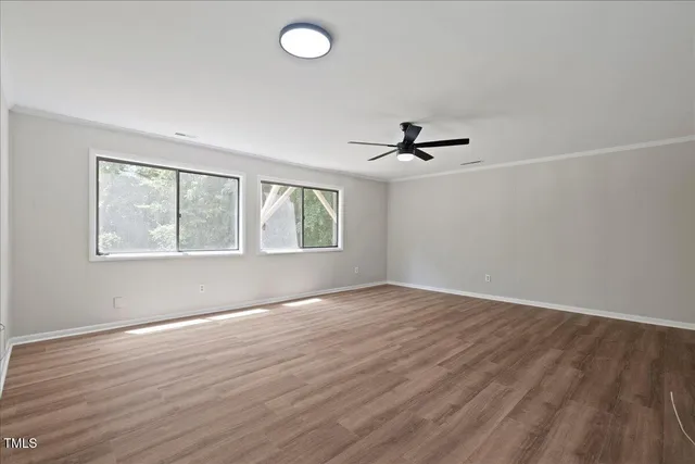 a view of balcony with wooden floor and fence