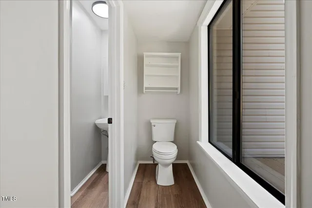 a view of balcony with wooden floor