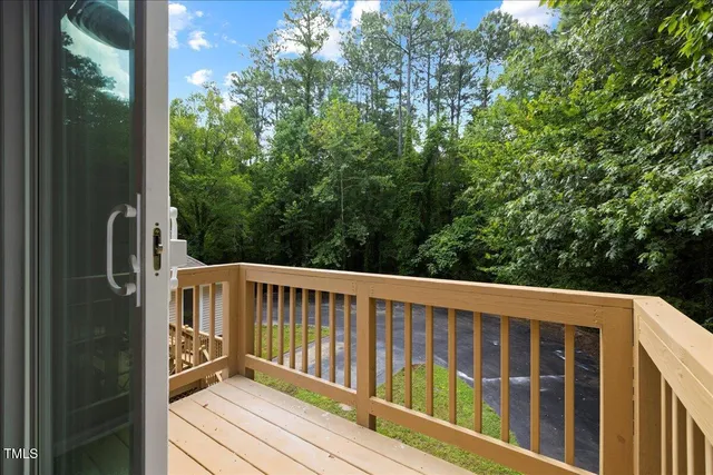 a view of balcony with two chairs and a barbeque