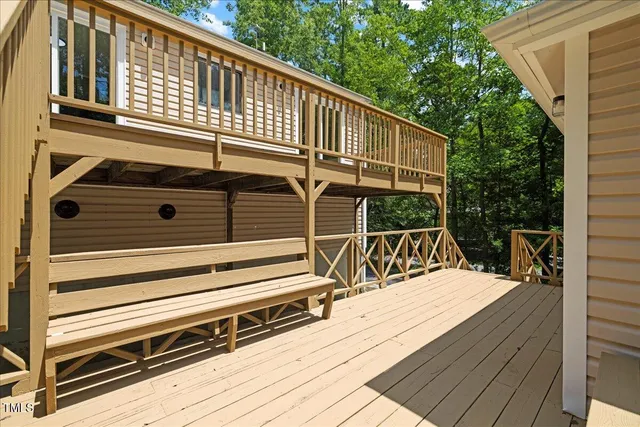 a view of a house with backyard and a tree