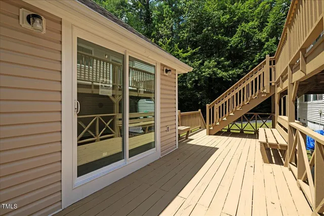a view of a house with a swimming pool and a yard