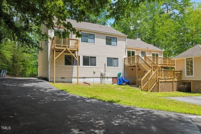 an aerial view of a house with outdoor space swimming pool and outdoor seating