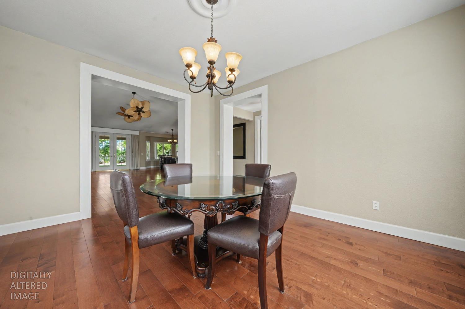 532 Oakridge Road Valley Springs, CA 95252 - Photo 26 of 89 a view of a dining room with furniture a chandelier and wooden floor