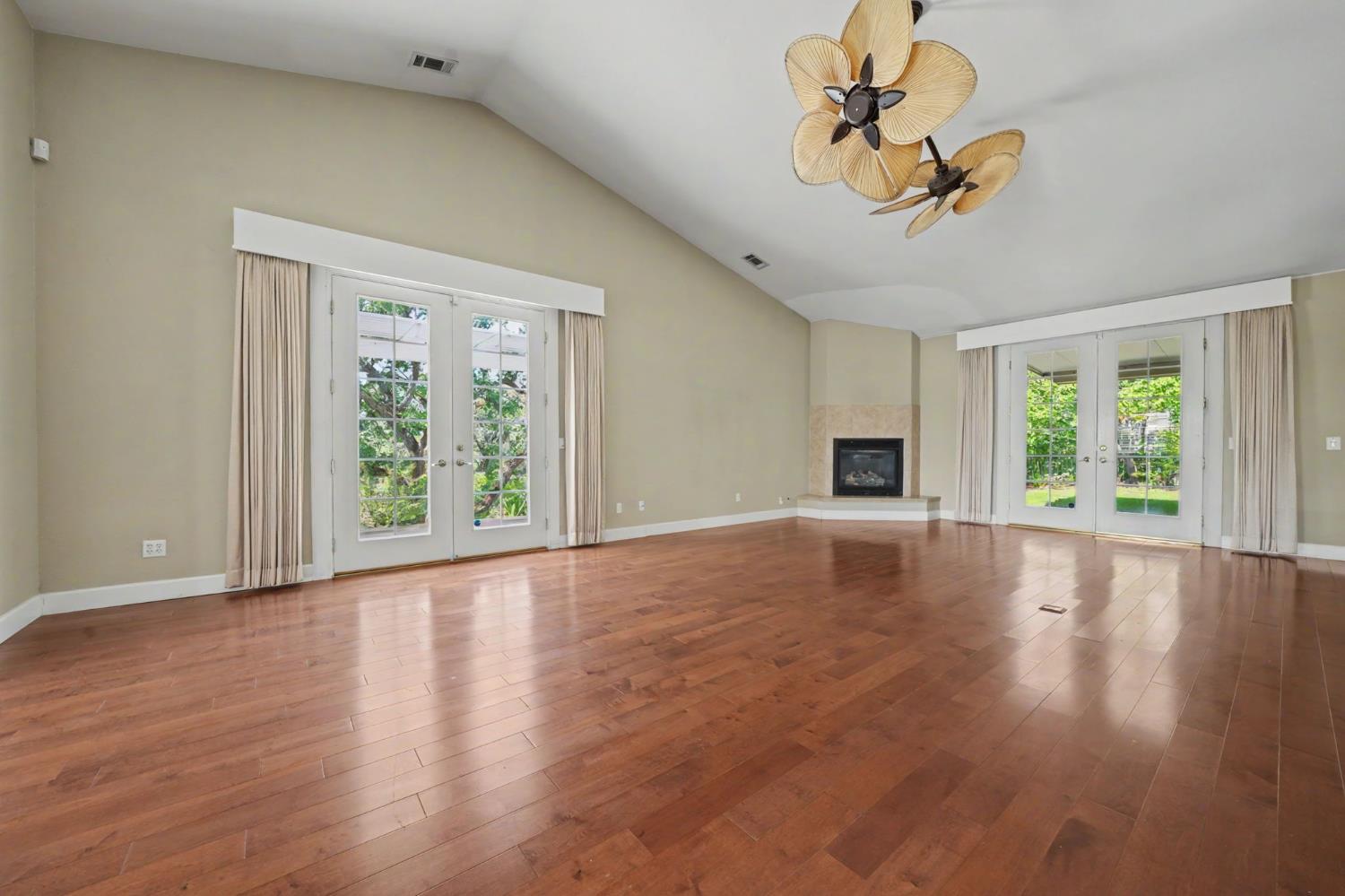 532 Oakridge Road Valley Springs, CA 95252 - Photo 28 of 89 a view of an empty room with wooden floor and a window