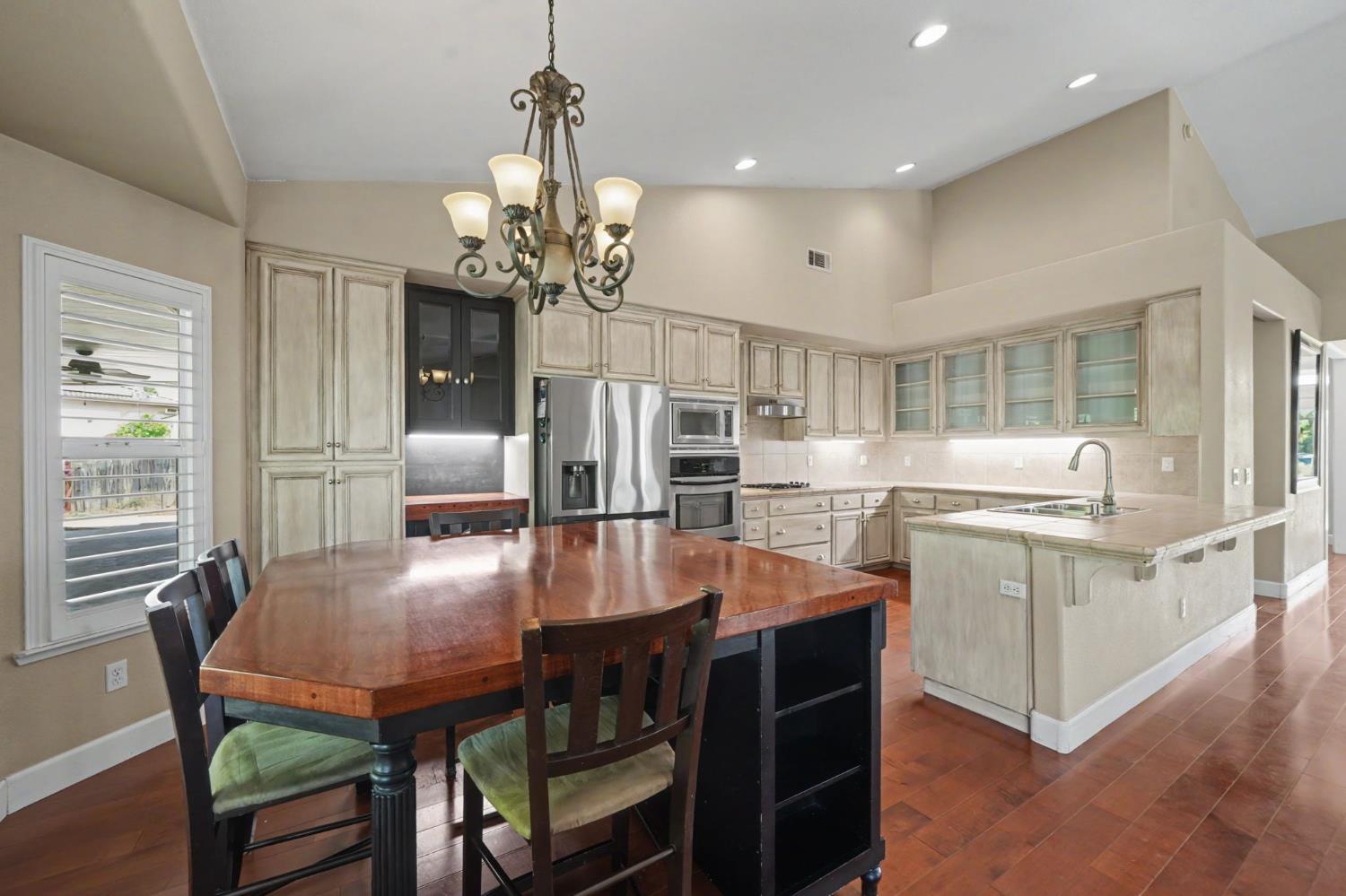 532 Oakridge Road Valley Springs, CA 95252 - Photo 33 of 89 a kitchen with stainless steel appliances granite countertop a dining table chairs and granite counter tops