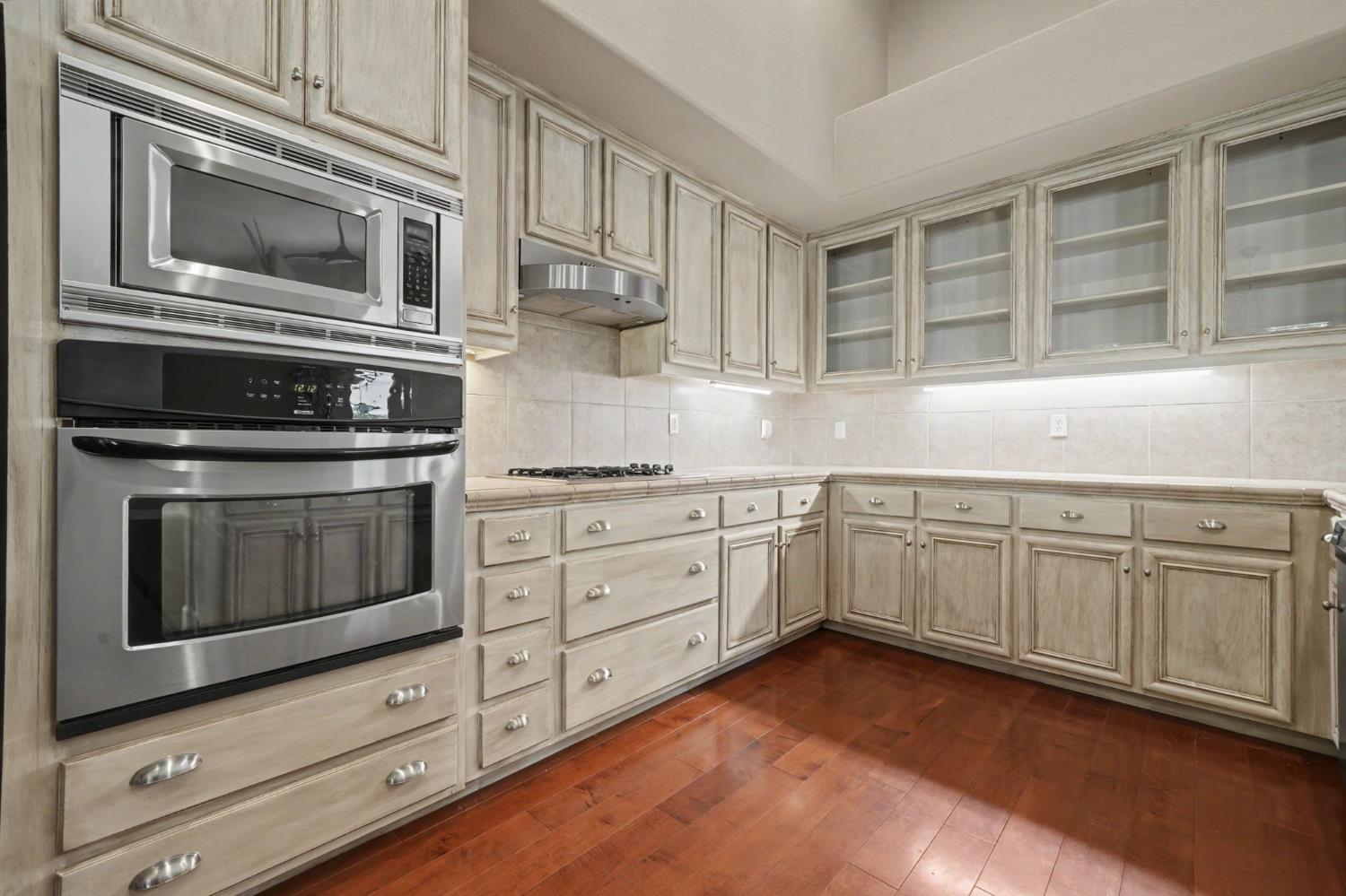 532 Oakridge Road Valley Springs, CA 95252 - Photo 37 of 89 a kitchen with granite countertop white cabinets stainless steel appliances and sink