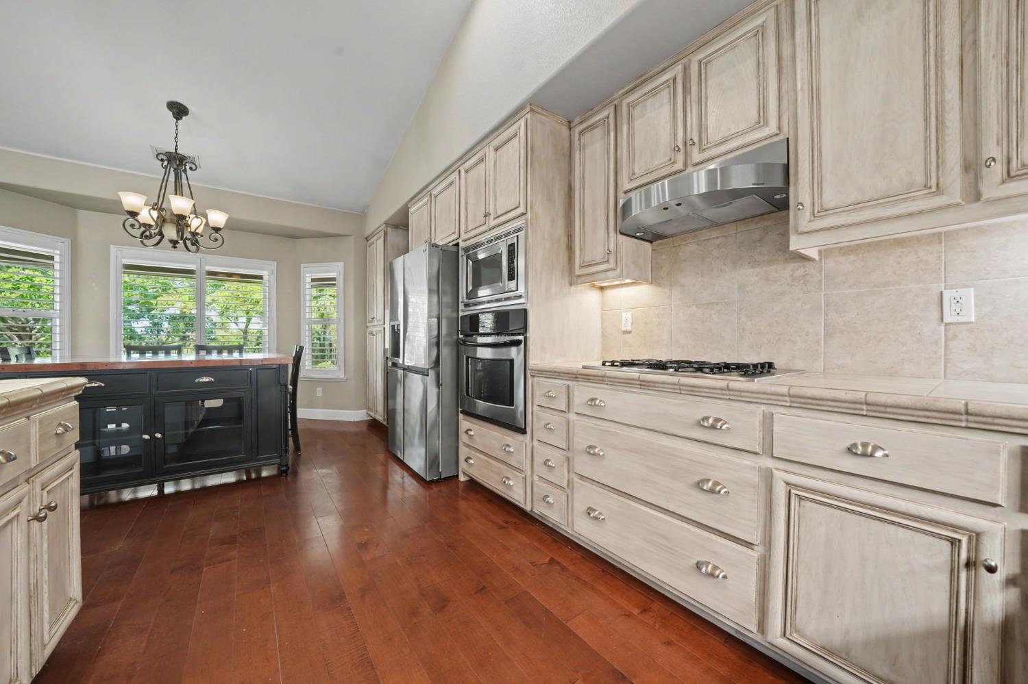 532 Oakridge Road Valley Springs, CA 95252 - Photo 39 of 89 a kitchen with stainless steel appliances kitchen island granite countertop a refrigerator and cabinets