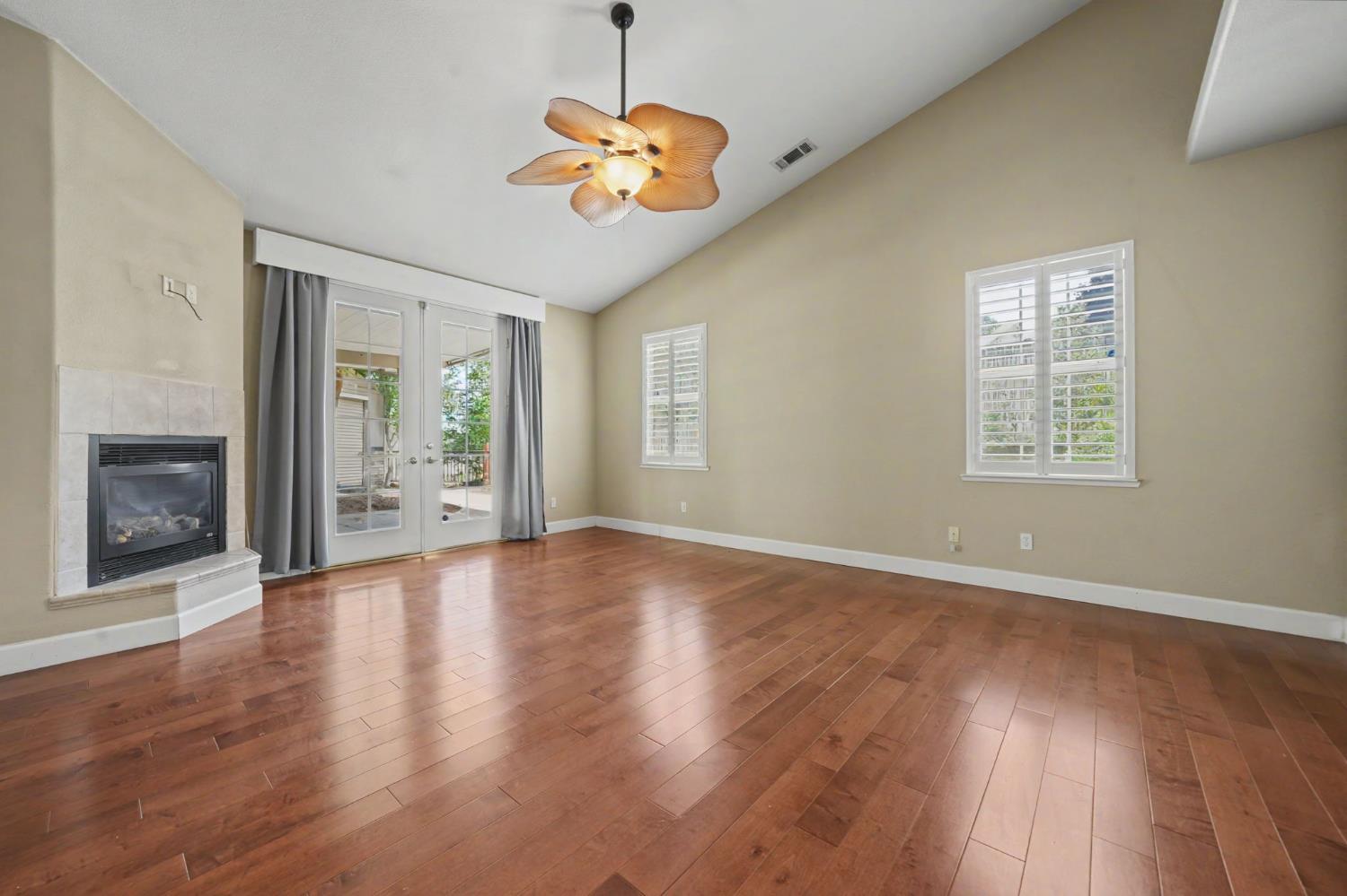 532 Oakridge Road Valley Springs, CA 95252 - Photo 45 of 89 a view of an empty room with wooden floor and a window